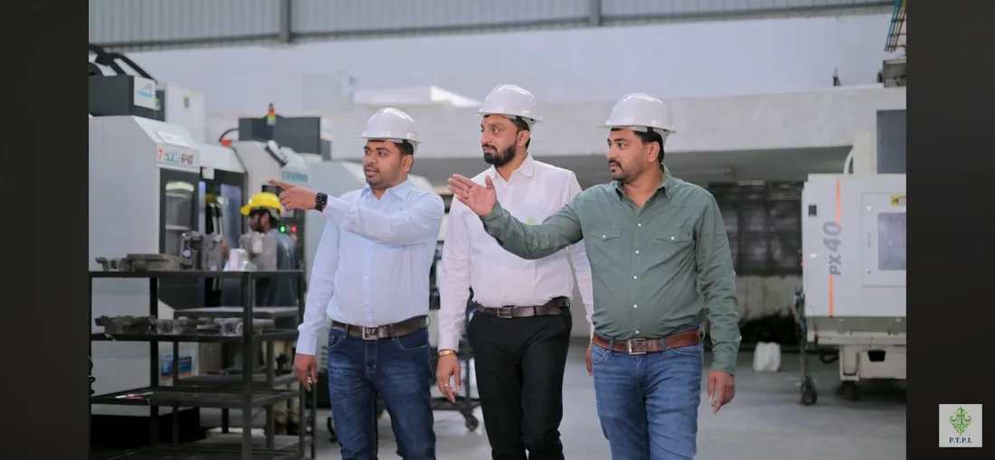 PTPL engineers discussing technical requirements on the shop floor